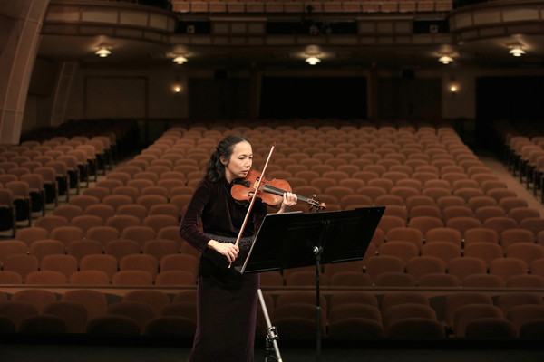 Image about Violinist performs at empty Sunset
