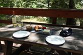 Riverside dining from your private cabin deck&mdash;Ripplewood provides everything you need for a relaxing escape. (Thumbnail)