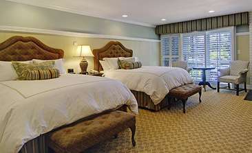 Image about Deluxe room with two queen beds.