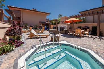 Image about Outdoor courtyard and jacuzzi.