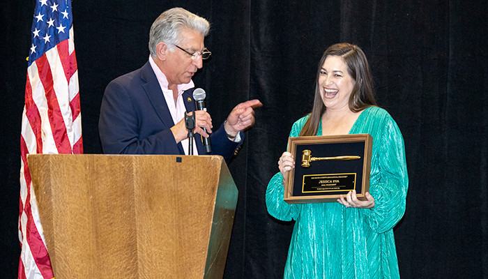 2021 President David Zigal passing the presidential gavel to 2022 President Jessica Eva