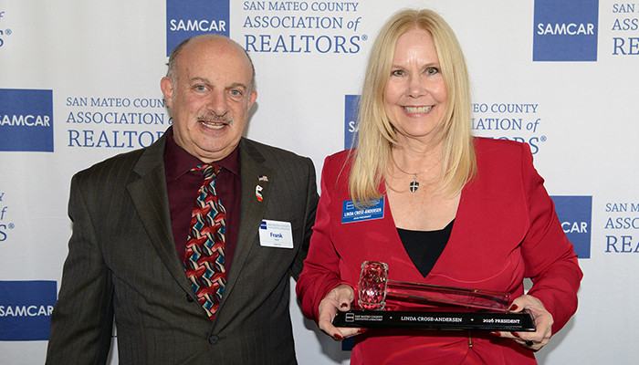 Photo by Scott Buschman. 2025 SAMCAR President Frank Vella presenting gavel to 2026 SAMCAR President Linda Crose-Andersen at Installation ceremony February 6, 2026.