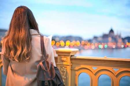 Woman on Bridge Overlooking Danube River