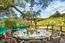 Outdoor dining area surrounded by terraced vineyards (Image 1)