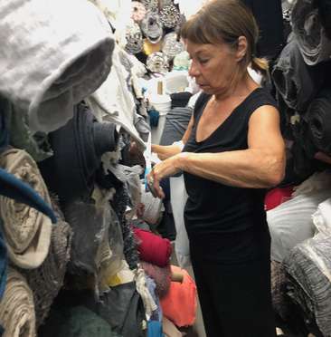 Image about Loes selecting fabric in LA