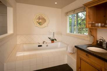 Image about Cottage Suite with in room jacuzzi and wood burning fireplace.