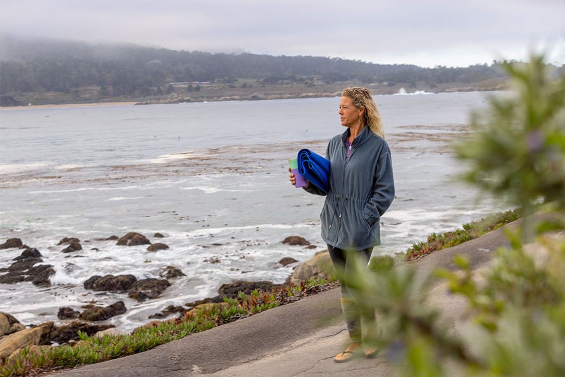Image of woman near the ocean in Carmel