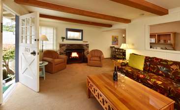 Image about Warm up by a wood-burning fireplace in your living room.
