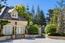 The property boasts beautiful stone construction and pristine landscaping (Image 3)