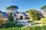 A spacious courtyard provides a welcoming front entrace (Image 4)